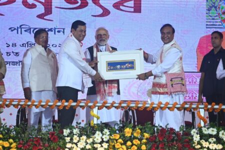 Chief Minister Dr. Himanta Biswa Sarma in the presence of Prime Minister Narendra Modi is receiving the certificates.